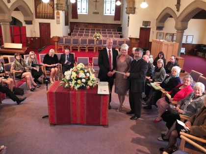 Rev Ian Lucraft presents Shirley and David with their certificate.